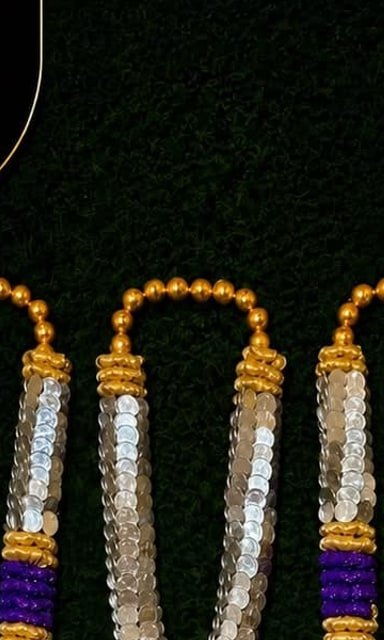 Silver and purple currency-note garlands