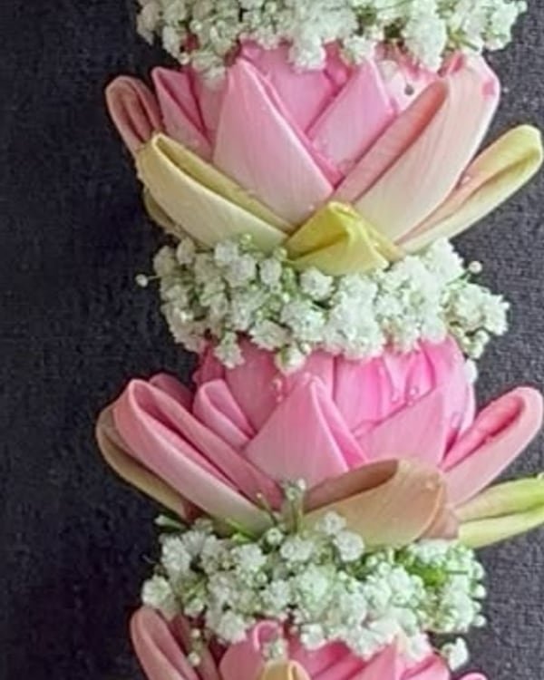 Purple orchid and pink lotus reception garlands